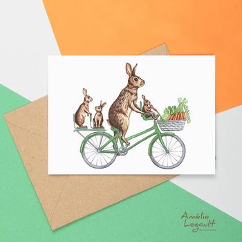 Carte de souhaits de lapins à vélo