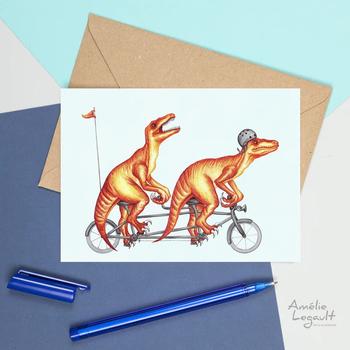 Carte de souhaits de vélociraptors à vélo